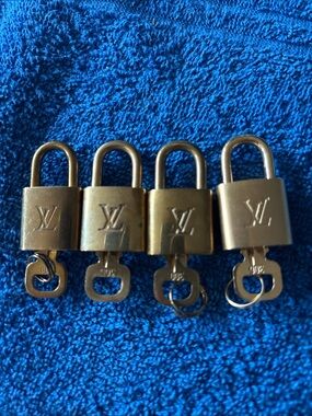 Louis Vuitton Gold Tone Padlock Set of Four